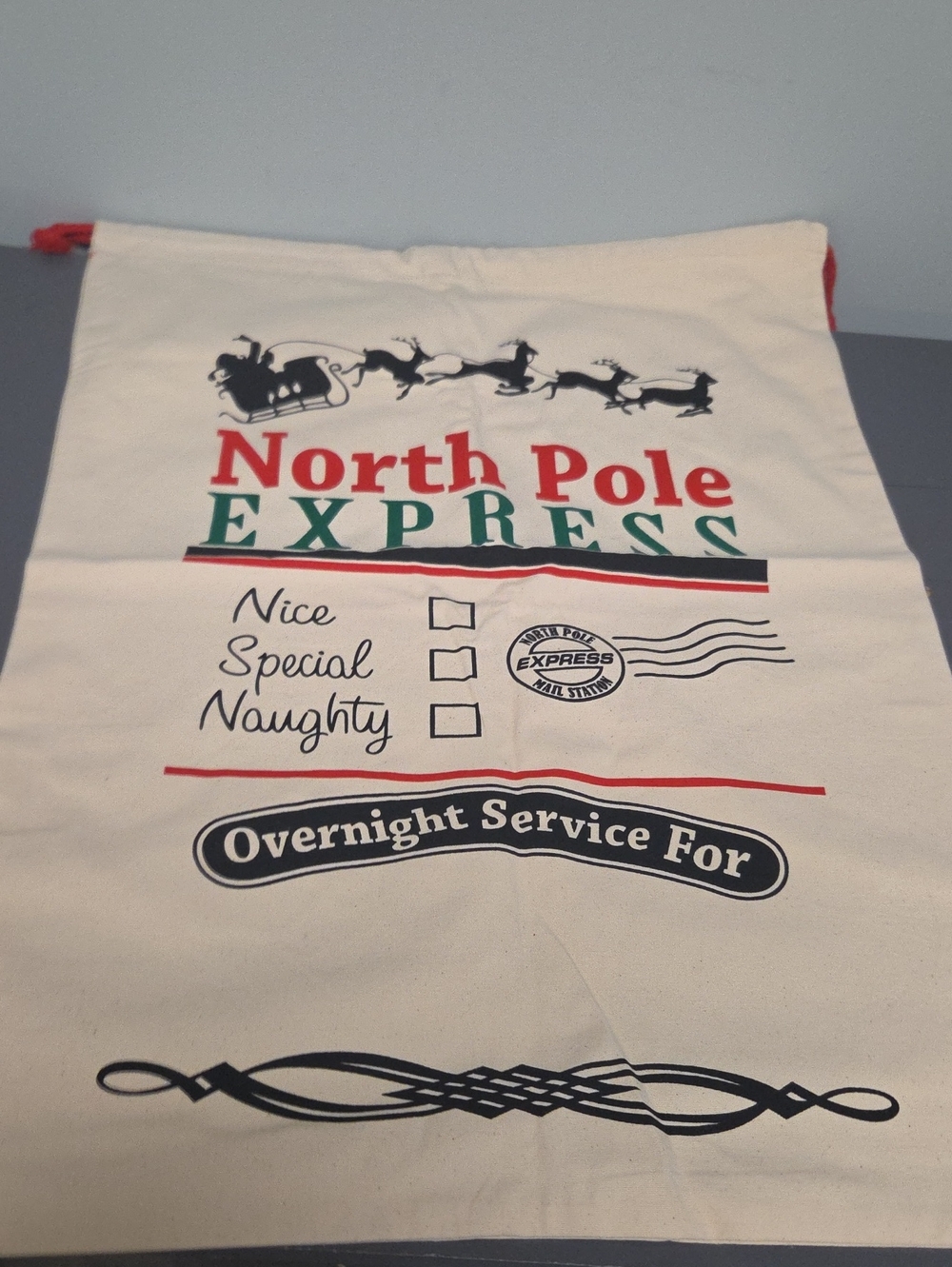 North Pole Express Kids Pajama Sack - Cream with Red & Green Print